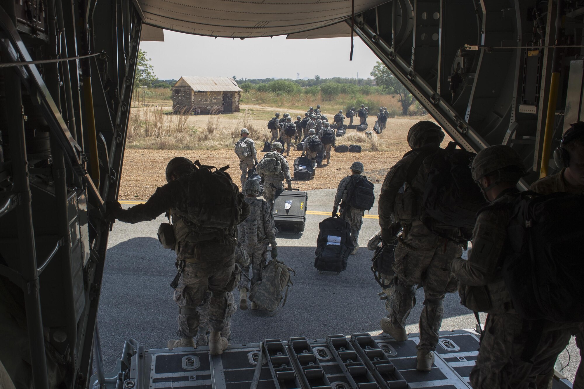 U.S. Soldiers, along with East Africa Response Force soldiers, depart a U.S. Air Force C-130 Hercules aircraft in Juba, Sudan, Dec. 18, 2013. The U.S. State Department requested the assistance of U.S. military forces in evacuating personnel from the embassy in Juba to Nairobi, Kenya, amid political and ethnic violence in South Sudan. 