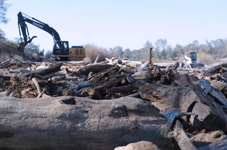 Construction equipment completes final touches to the woody fish hideouts built along the lower Yuba River as part of a pilot project by the U.S. Army Corps of Engineers Sacramento District. The project seeks to add habitat for sheltering juvenile steelhead and Chinook salmon.