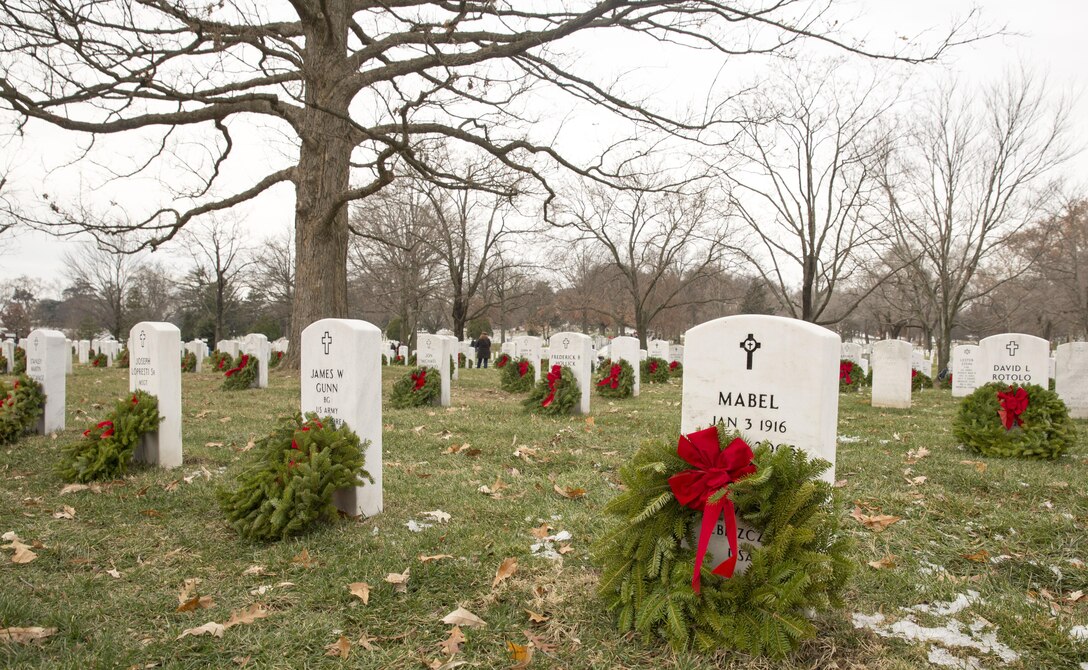 Headstones throughout Arlington National Cemetery, in Arlington Va. were adorned with wreaths during Wreaths Across America Day, Dec. 14. Fifty Marines and sailors from Marine Corps Base Camp Lejeune traveled to Arlington National Cemetery through a Single Marine Program trip to take part in the event.