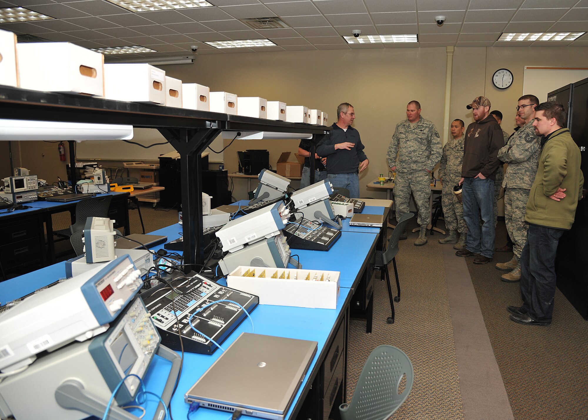Members of the 372nd Training Squadron listen as representatives from the Northland Community and Technical College discuss their classroom teaching methods Dec. 18, 2013 in Thief River Falls, Minn. The 372nd TRS visited the NC&TC to compare and synergize teaching methods in classrooms at the two locations. (U.S. Air Force photo/Airman 1st Class Zachiah Roberson)