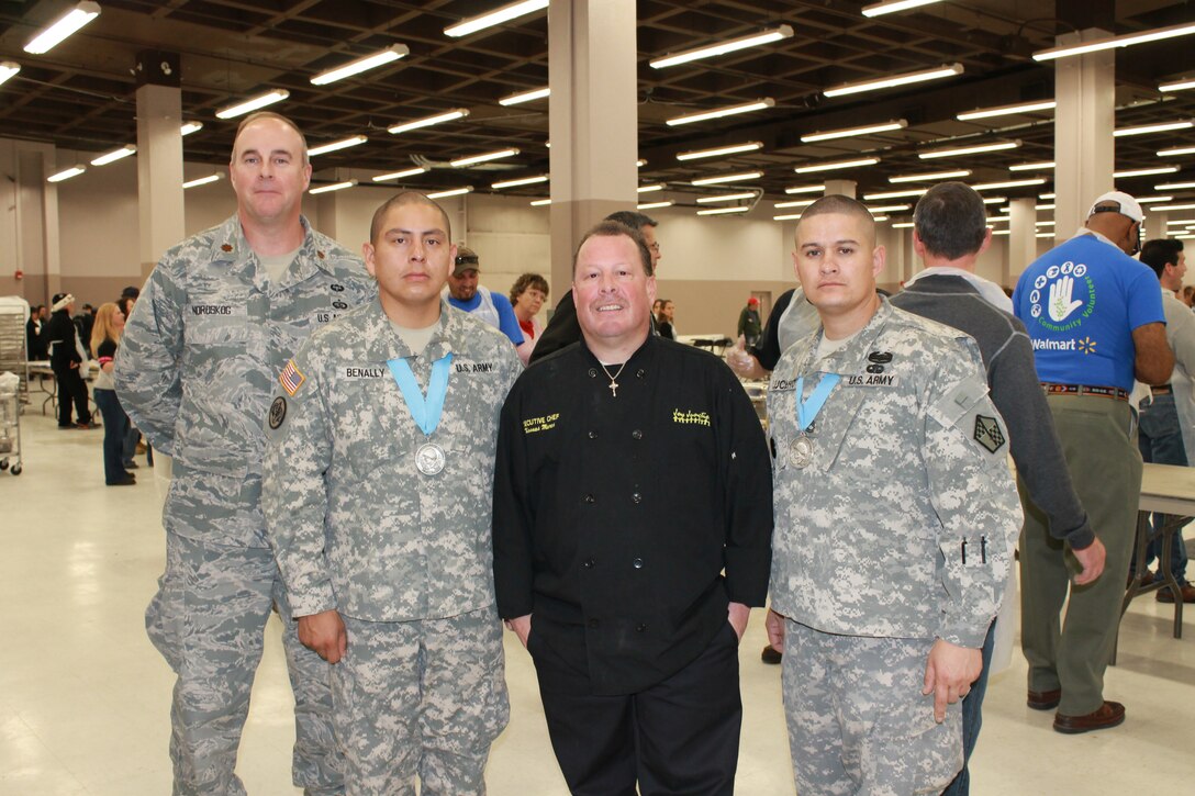 On Dec. 20, Albuquerque Military Entrance and Processing Station staff members volunteered at Joy Junction, New Mexico’s largest homeless shelter. The event at the Albuquerque Convention Center fed approximately 1,500 homeless and hungry people from across the metro area. Participating in the event, from left: Maj. Craig Nordskog, MEPS commander; Staff Sgt. Quentin Benally, MEPS Human Resources Assistant; Joy Junction Executive Chef Thomas Mares; and Sgt. 1st Class Martin Lucero, MEPS Human Resources Assistant.  