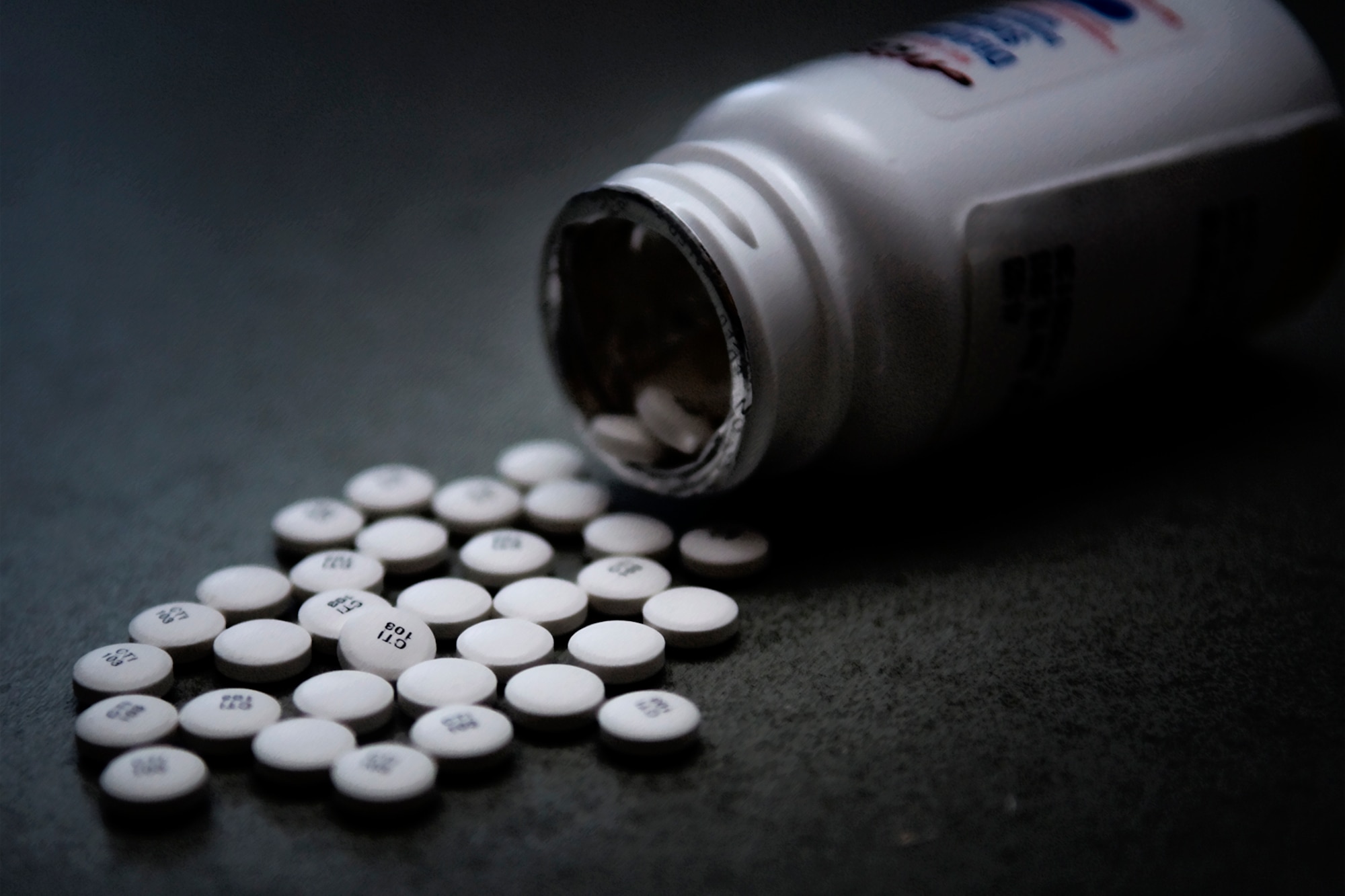 Prescription pain pills are seen dumped out on a table at Grissom Air Reserve Base, Ind. Airmen who take prescription pills that are not their own or are taken after the time allotted could find themselves facing severe discipline. (U.S. Air Force photo illustration/Tech. Sgt. Mark R. W. Orders-Woempner) 
