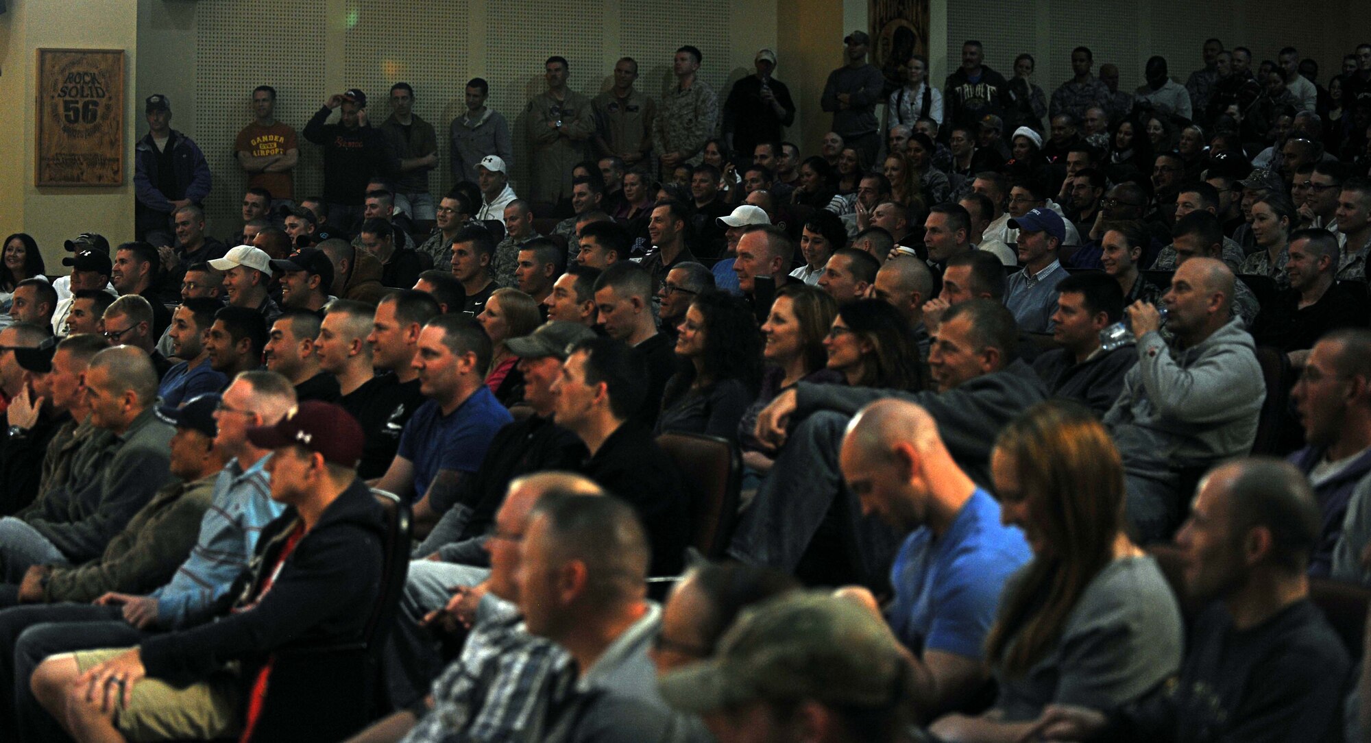 386th Air Expeditionary Wing personnel enjoy a performance from country music singer Kellie Pickler during her seventh United Service Organization (USO) tour at an undisclosed location Southwest Asia. The new USO, “Every Moment Counts” campaign encourages all Americans to show troops their gratitude; Pickler’s contribution includes a nine-day tour around the area of responsibility. (U.S. Air Force photo by Senior Airman Desiree W. Moye)