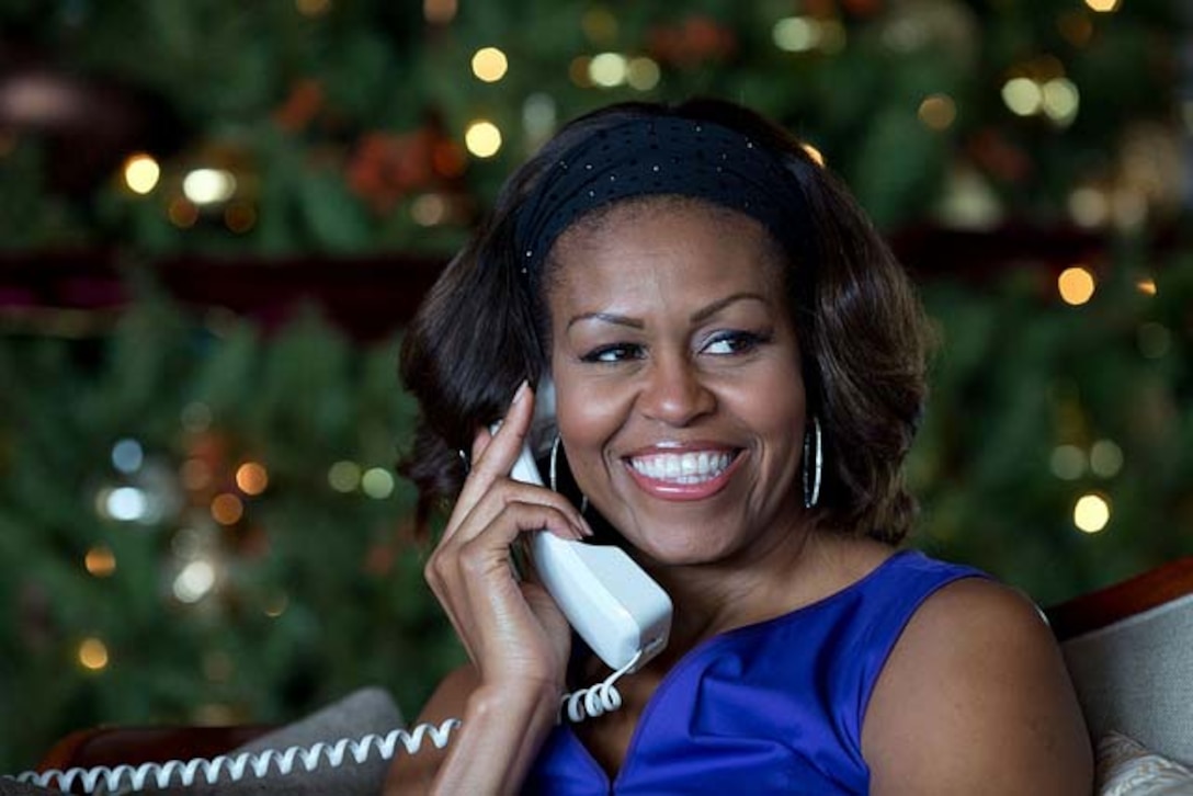 First Lady Michelle Obama reacts while talking on the phone to children across the country as part of the annual North American Aerospace Defense Command (NORAD) Tracks Santa program. The first lady, who’s in Hawaii on vacation with her husband President Barack Obama and other family members, answered the phone calls from Kailua, Christmas Eve, Dec. 24, 2013. Official White House photo by Pete Souza