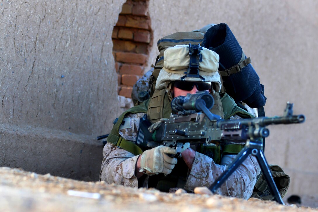 U.S. Marine Corps Cpl. Tyler Hargett provides security during a ...