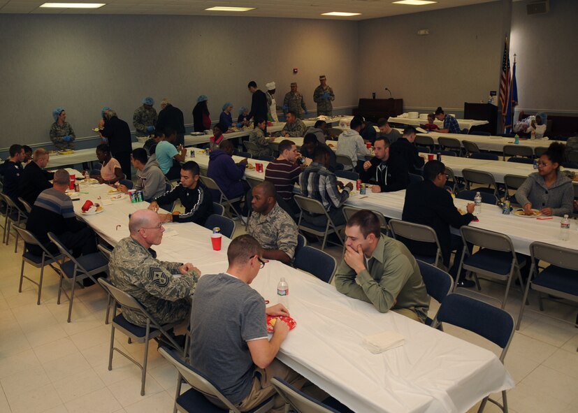 Airmen living in the dorms enjoy a Christmas lunch on Barksdale Air Force Base, La., Dec. 25, 2013. The First Sergeant's Council held the luncheon for the Airman and base leadership and volunteers prepared and served the food. (U.S. Air Force photo/Staff Sgt. Sean Martin)

