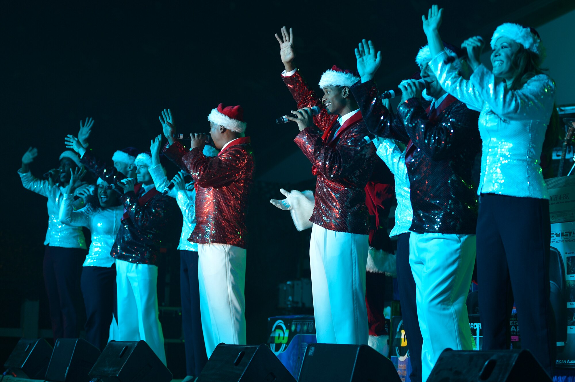 Members of the Air Force Entertainment Group perform for deployed Service members at Bagram Airfield, Afghanistan, Dec. 24, 2013. The group performed a holiday tour that included 15 performances at 10 locations throughout Southwest Asia. (U.S. Air Force photo by Senior Airman Kayla Newman/Released)