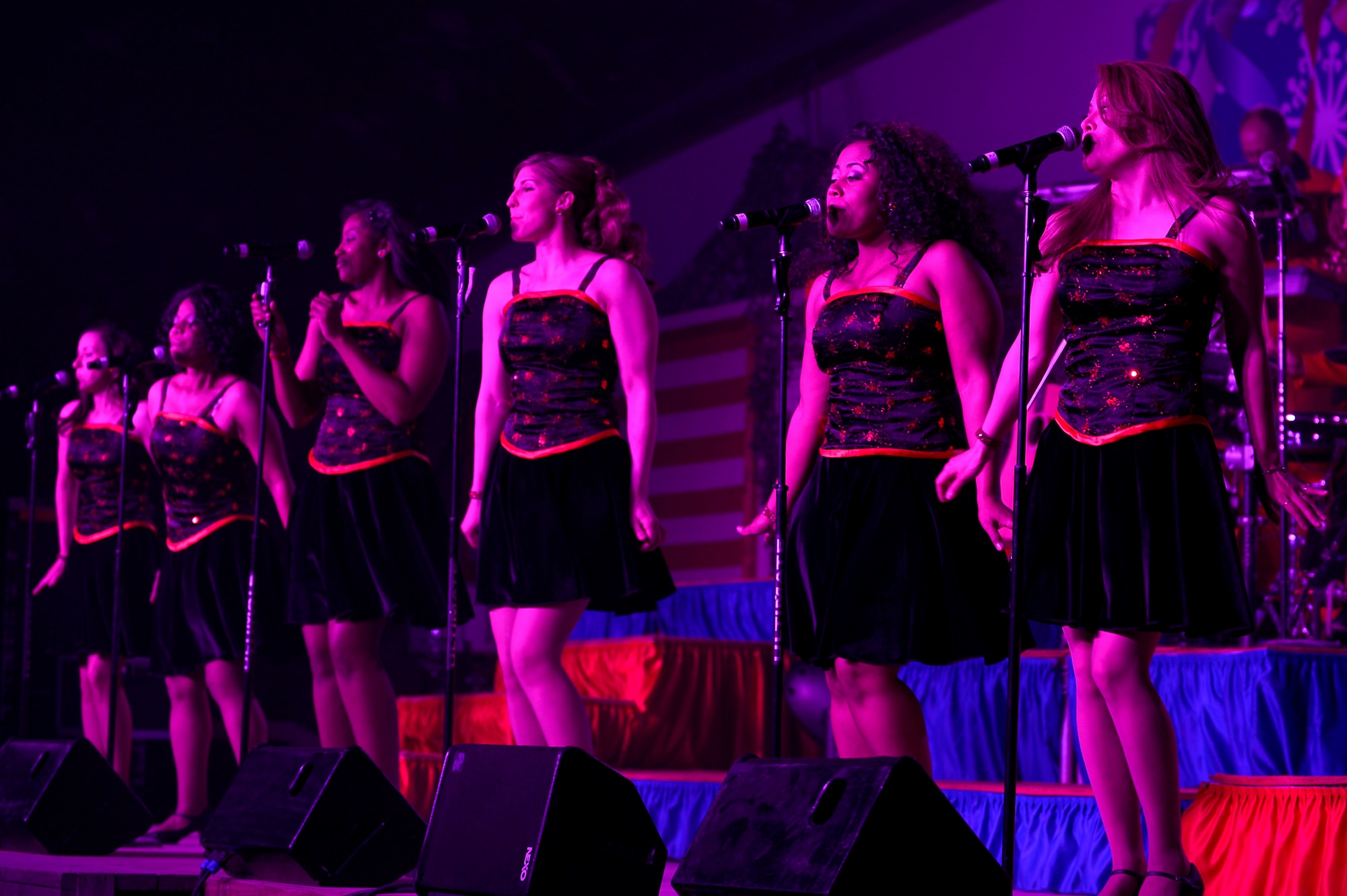 Members of the Air Force Entertainment Group perform for deployed Service members at Bagram Airfield, Afghanistan, Dec. 24, 2013. The Air Force Entertainment Group comprised of 27 former Tops in Blue members, performed a holiday show for deployed Service members. (U.S. Air Force photo by Senior Airman Kayla Newman/Released)