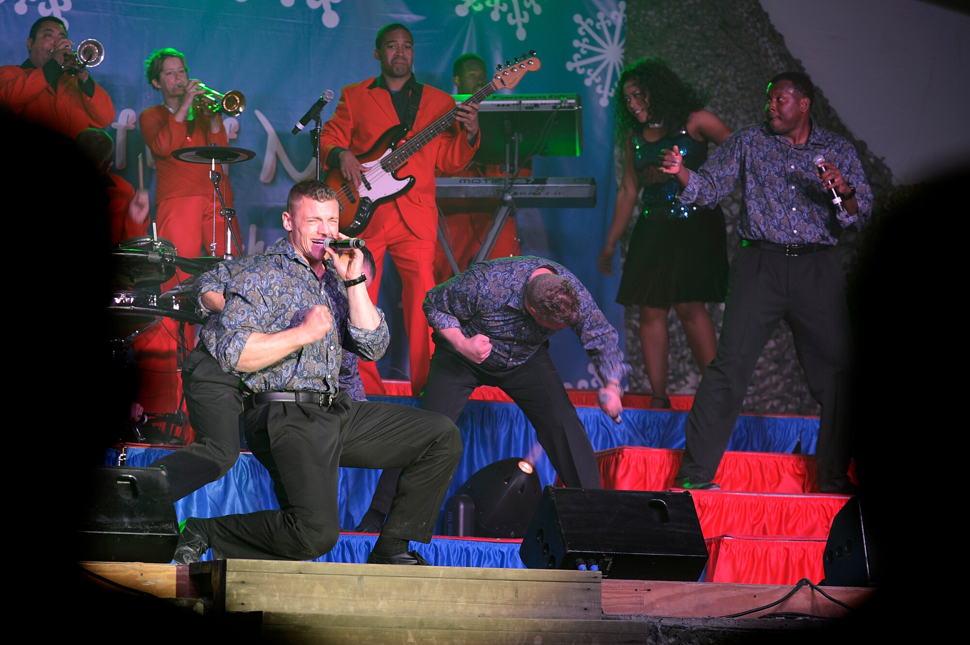 Members of the Air Force Entertainment Group perform for deployed Service members at Bagram Airfield, Afghanistan, Dec. 24, 2013. The holiday tour includes 15 performances at 10 locations throughout Southwest Asia. (U.S. Air Force photo by Senior Airman Kayla Newman/Released)