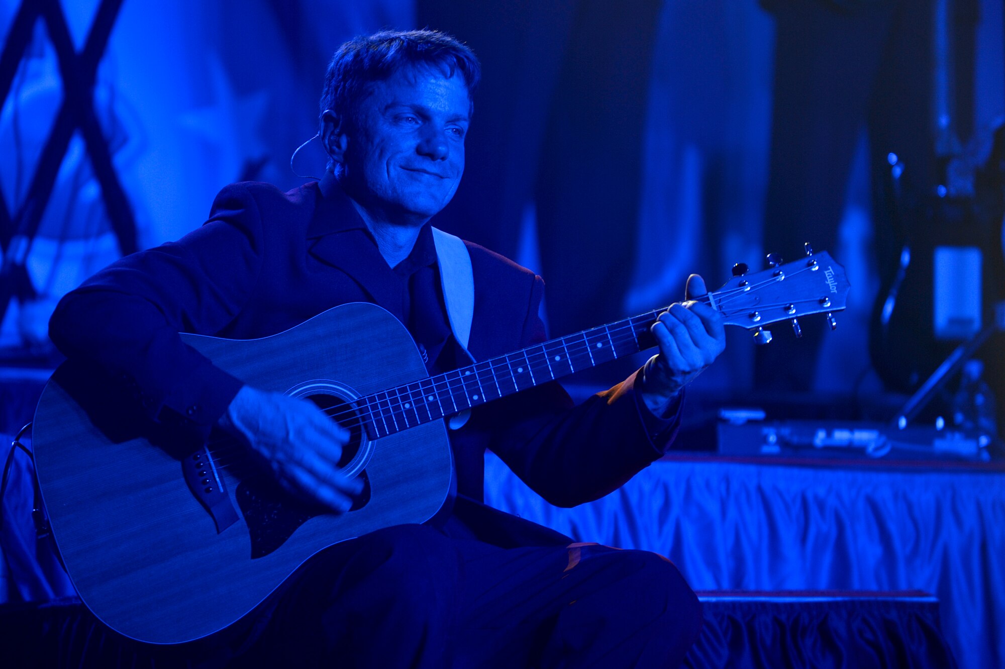 Scott Sutherland, Air Force Entertainment Group guitarist, performs for deployed Service members at Bagram Airfield, Afghanistan, Dec. 24, 2013. Sutherland was a member of Tops in Blue in 1996 and 1997. (U.S. Air Force photo by Senior Airman Kayla Newman/Released)