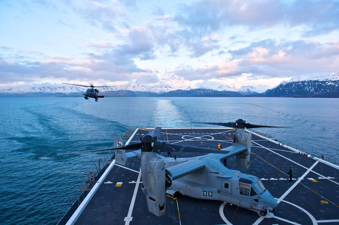 An Alaska Air National Guard HH-60G Pave Hawk combat search and rescue helicopter from the 210th Rescue Squadron at Joint Base Elmendorf-Richardson prepares to land April 30, 2013, at Cook Inlet on the USS Anchorage, an amphibious landing craft. Pilots from the 210th RQS practiced landing on the USS Anchorage to receive training not readily available in the region. (U.S. Air Force photo/Staff Sgt. Zachary Wolf)