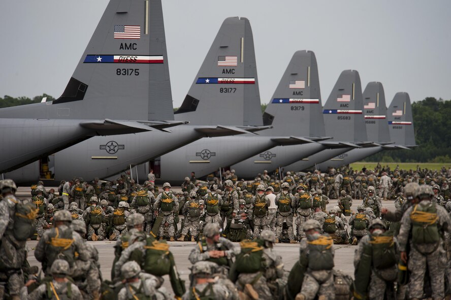 Soldiers from the 82nd Airborne Division ready their gear prior to jumping from Air Force C-130J Hercules during a Joint Operation Access exercise June 24, 2013, at Pope Field, N.C. A total of 2,426 paratroopers jumped out of C-130Js assigned to Dyess Air Force Base, Texas, during the 12-day exercise. JOAX is a combined military training exercise designed to prepare Airmen and Soldiers to respond to worldwide crises and contingencies. (U.S. Air Force photo/Airman 1st Class Damon Kasberg)