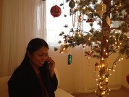 Senior Chief Petty Officer Vilma T. Rodriguez speaks with President Barack Obama over the phone Christmas day, while celebrating the holiday at a friend's place on Camp Shields, Okinawa, Japan. "In my 18 - almost 19 - years in the Navy I've never experienced anything like this," said Rodriguez. "To receive a call from the president, it's a big deal. It's an honor." Rodriguez was nominated for her admirable performance during Operation Damayan, the military relief effort in the Republic of the Philippines following Typhoon Haiyan. During the operation, she returned to Tacloban, one of the hardest hit areas as well as her hometown. Denying her personal desire to search for her brother, missing since the storm hit the region, she dedicated herself to the vital relief mission. Rodriguez is an independent duty corpsman at the Camp Kinser Group Aid Station, and belongs to Combat Logistics Regiment 37, 3rd Marine Logistics Group, III Marine Expeditionary Force.