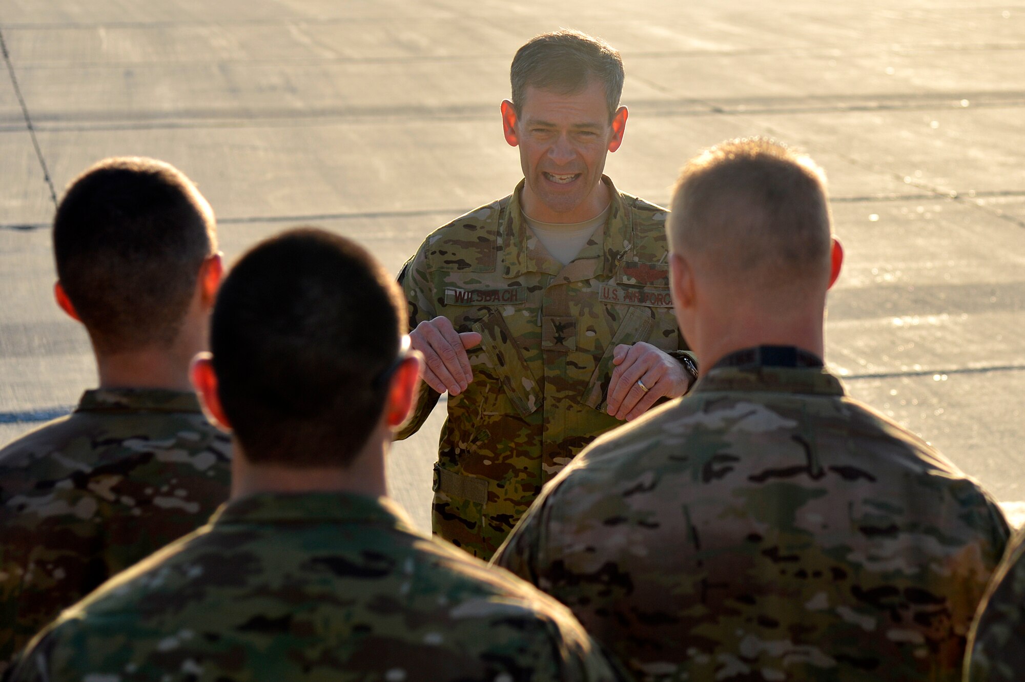 U.S. Air Force Maj. Gen. Kenneth Wilsbach, 9th Air and Space Expeditionary Task Force- Afghanistan; Deputy Commander -Air, U.S. Forces - Afghanistan; Deputy Chief of Staff - Air, International Security Assistance Force Joint Command, talks with C-130 maintainers during a tour at Bagram Airfield, Afghanistan, Dec. 25, 2013. Wilsbach also visited Service members at the Craig Joint Theater Hospital, an entry control point, the F-16 Fighting Falcon hangar, the A-10 Thunderbolt II hangar and the HH-60G Pavehawk hangar. (U.S. Air Force photo by Senior Airman Kayla Newman/Released)