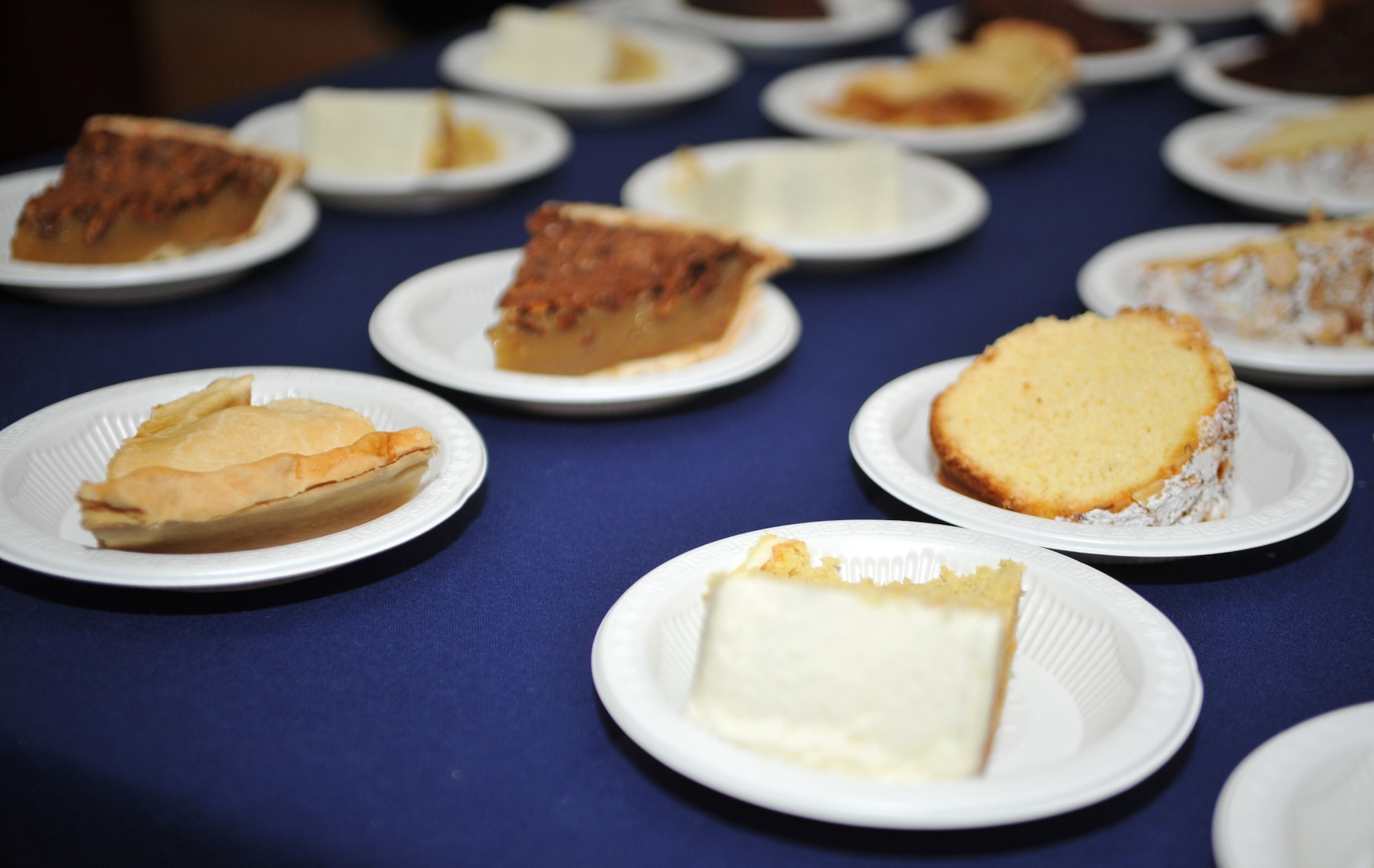 Dessert slices wait to be chosen during the Christmas meal in the Gingko Tree dining facility at Osan Air Base, Republic of Korea, Dec. 25, 2013. Pumpkin and pecan pie were among the many confections available to give one’s holiday meal a touch of home. (U.S. Air Force photo/Airman 1st Class Ashley J. Thum)