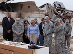 Among the National Guard responses in 2013 was the devastating tornado in Moore, Okla., on May 20. Mary Fallin, governor of Oklahoma, leads Gen. Frank J. Grass, chief, National Guard Bureau, through the Plaza Towers Elementary School in Moore, Okla., where seven students were killed.