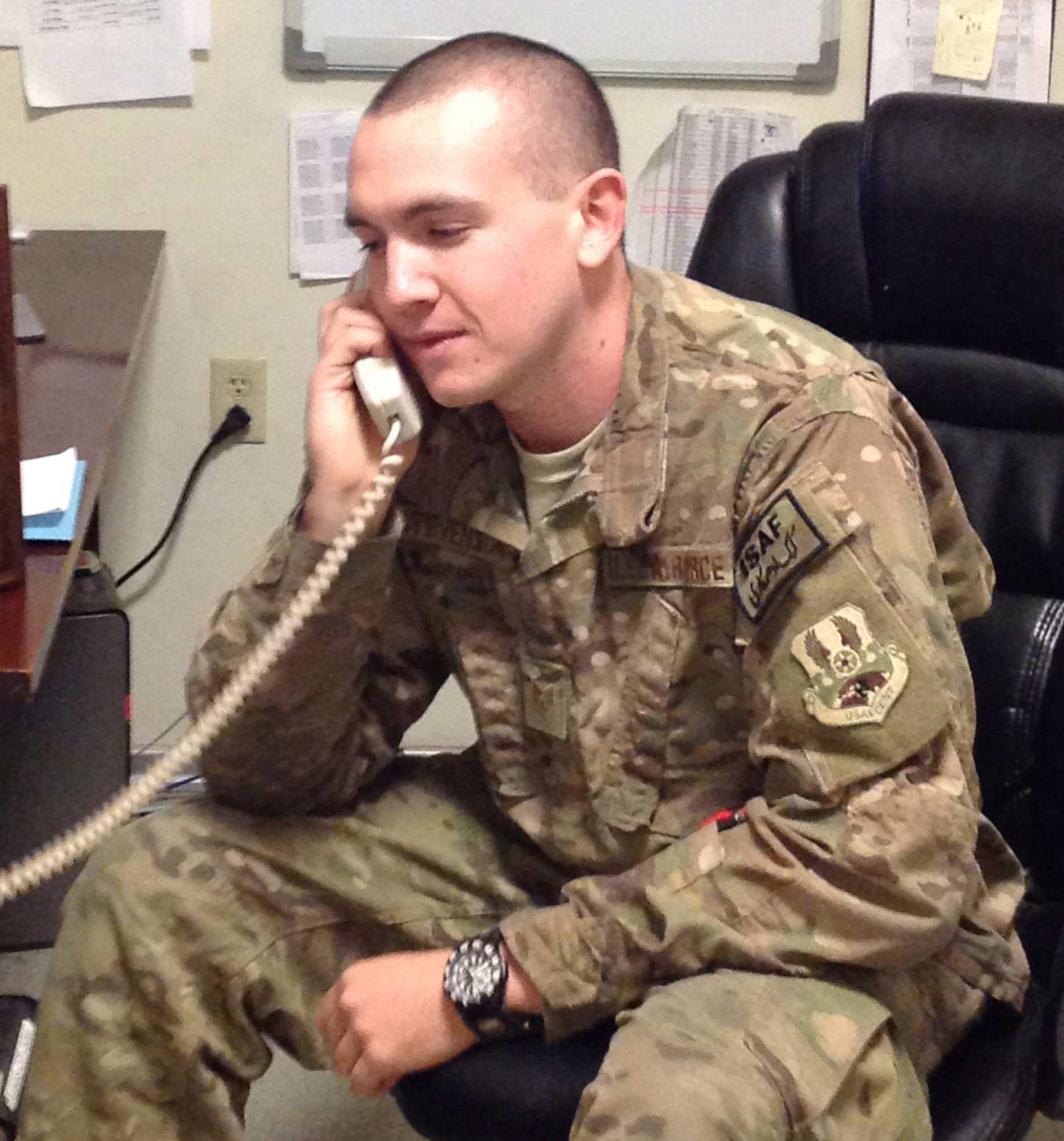 Staff Sgt. Michael Stevenson receives a Christmas Day call from President Barack Obama, Dec. 25th, 2013 at Bagram Airfield, Afghanistan. Every year, the president selects service members to call and wish them and their family happy holidays. (U.S. Air Force Photo/Master Sergeant Thomas Ward)
