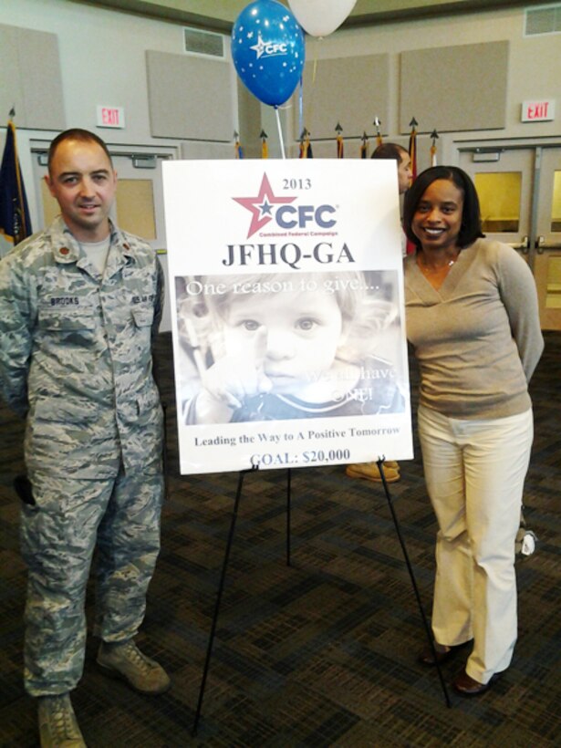 Maj. Roger Brooks, Air National Guard Combined Federal Campaign representative and Brande Newsome, 94th Airlift Wing CFC coordinator, welcome CFC representatives to a kick0off luncheonat Clay National Guard Center Nov. 8. (U.S. Air Force photo/Rita Weldon)