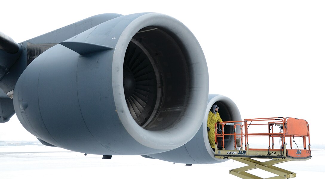 WRIGHT-PATTERSON Air Force Base, Ohio--Master Sgt.  Michael W. Rosato, Jr., 445th Aircraft Maintenance Squadron jet engine craftsman, completes a post flight inspection on a C-17A Globemaster III engine December 17, 2013 at Wright Patterson Air Force Base, Ohio. Rosato looks for any damage or irregularity during the inspection. (U.S. Air Force Photo By Tech. Sgt, Frank Oliver)
