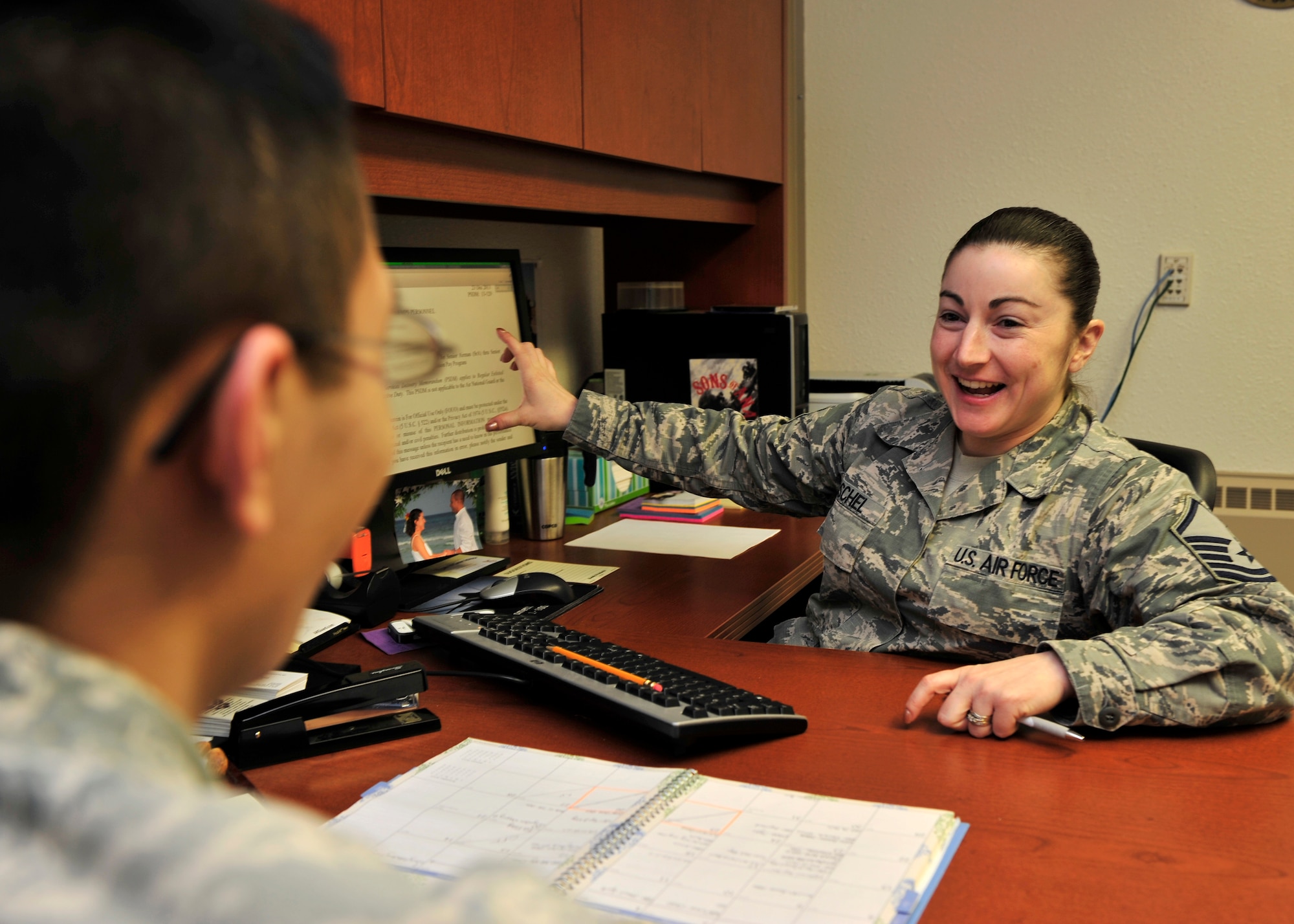 Master Sgt. Holly Roschel, 354th Fighter Wing career assistance advisor, discusses career options with an Airman Dec. 24, 2013, Eielson Air Force Base, Alaska. Roschel recently received Pacific Air Force’s General Billy J. Boles Mentorship Award. (U.S. Air Force photo by Senior Airman Ashley Nicole Taylor/Released)