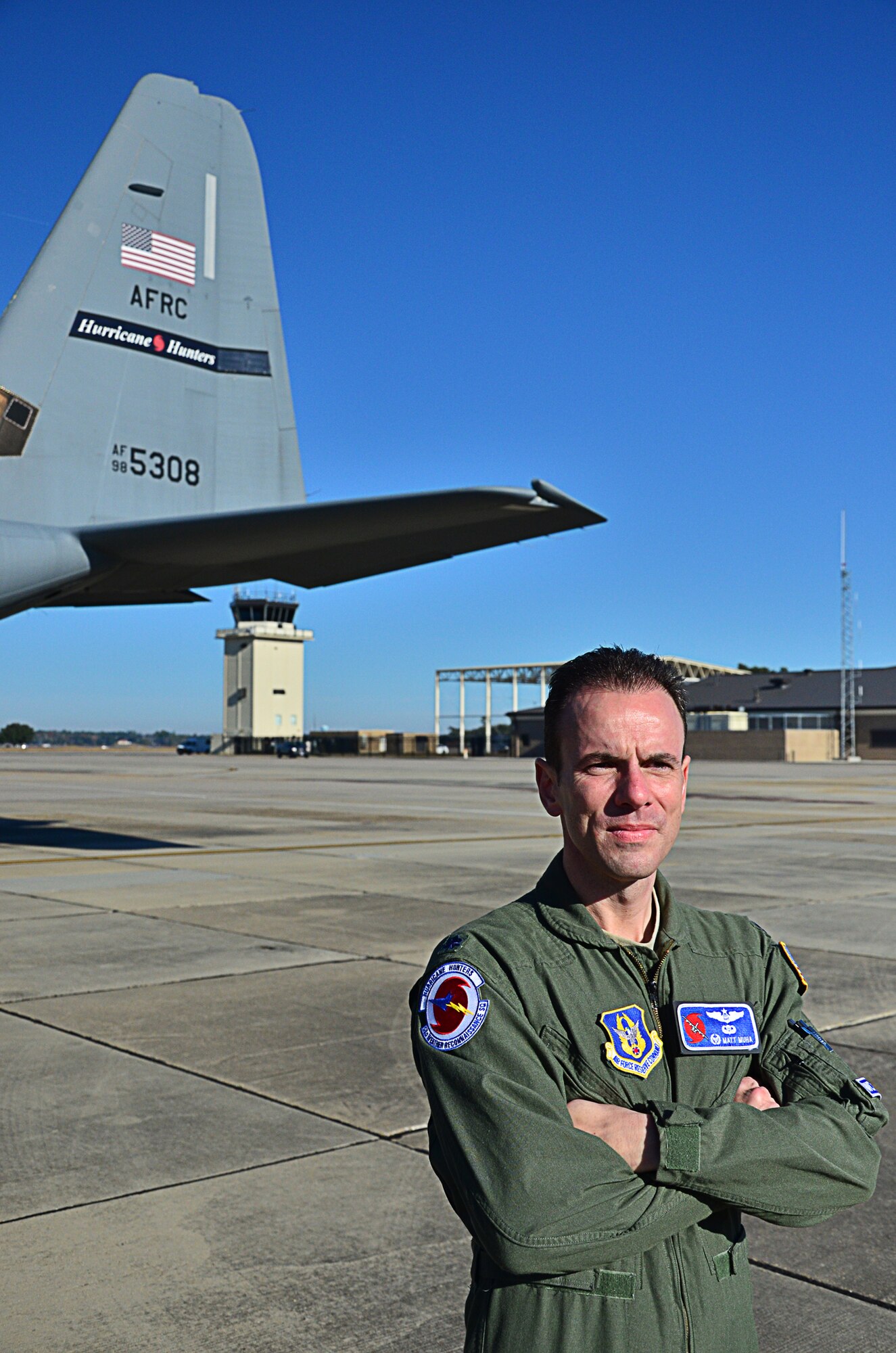 Lt. Col. Matthew Muha, the new commander of the 53rd Weather Reconnaissance
Squadron looks on as he watches one of the Hurricane Hunter WC-130Js prepare
to fly to St. Croix for the Roll up mission signifying the end of the hurricane season Dec 10.

