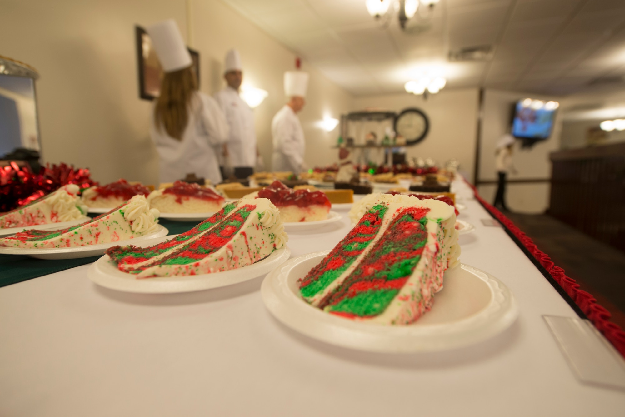 Slices of holiday cake lie at the desert table during Christmas lunch service at the Georgia Pines Dining Facility at Moody Air Force Base, Ga., Dec. 25, 2013. In addition to the cake, many other desert dishes were available to Moody Airmen and their families or local residents attending the lunch service. (U.S. Air Force photo by Airman Dillian Bamman/Released)