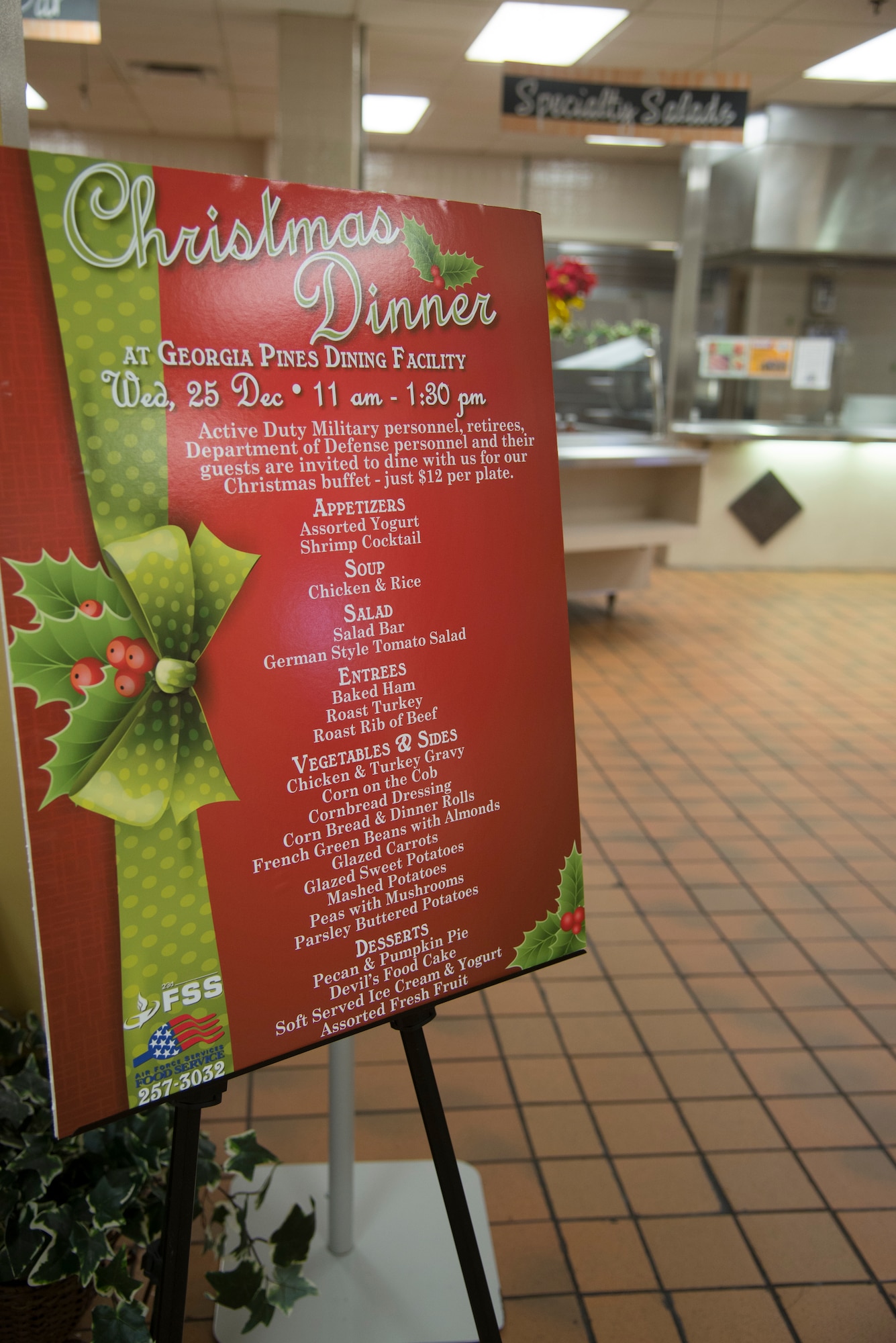 Moody leadership and their families help the Georgia Pines Dining Facility staff in hosting a Christmas lunch service at Moody Air Force Base, Ga., Dec. 25, 2013. The meal consisted of roast beef, turkey, ham and many sides to emulate a traditional Christmas dinner. (U.S. Air Force photo by Airman Dillian Bamman/Released)