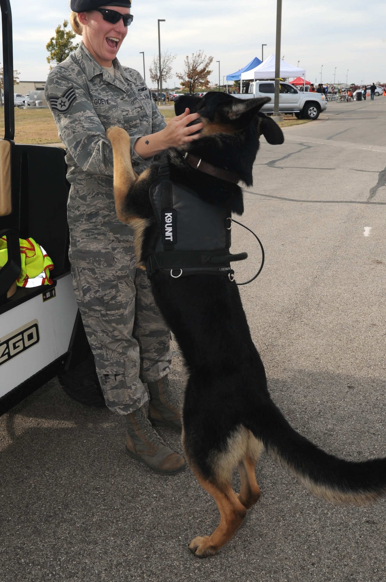 GOODFELLOW AIR FORCE BASE, TEXAS -- Staff Sgt. Amanda Goetz, 17th Security Forces Squadron military working dog handler, and her military working dog Jork, play during Community Appreciation Day Nov. 19, 2011. Jork passed away Nov. 21. (U.S. Air Force photo/ Staff Sgt. Laura R. McFarlane)