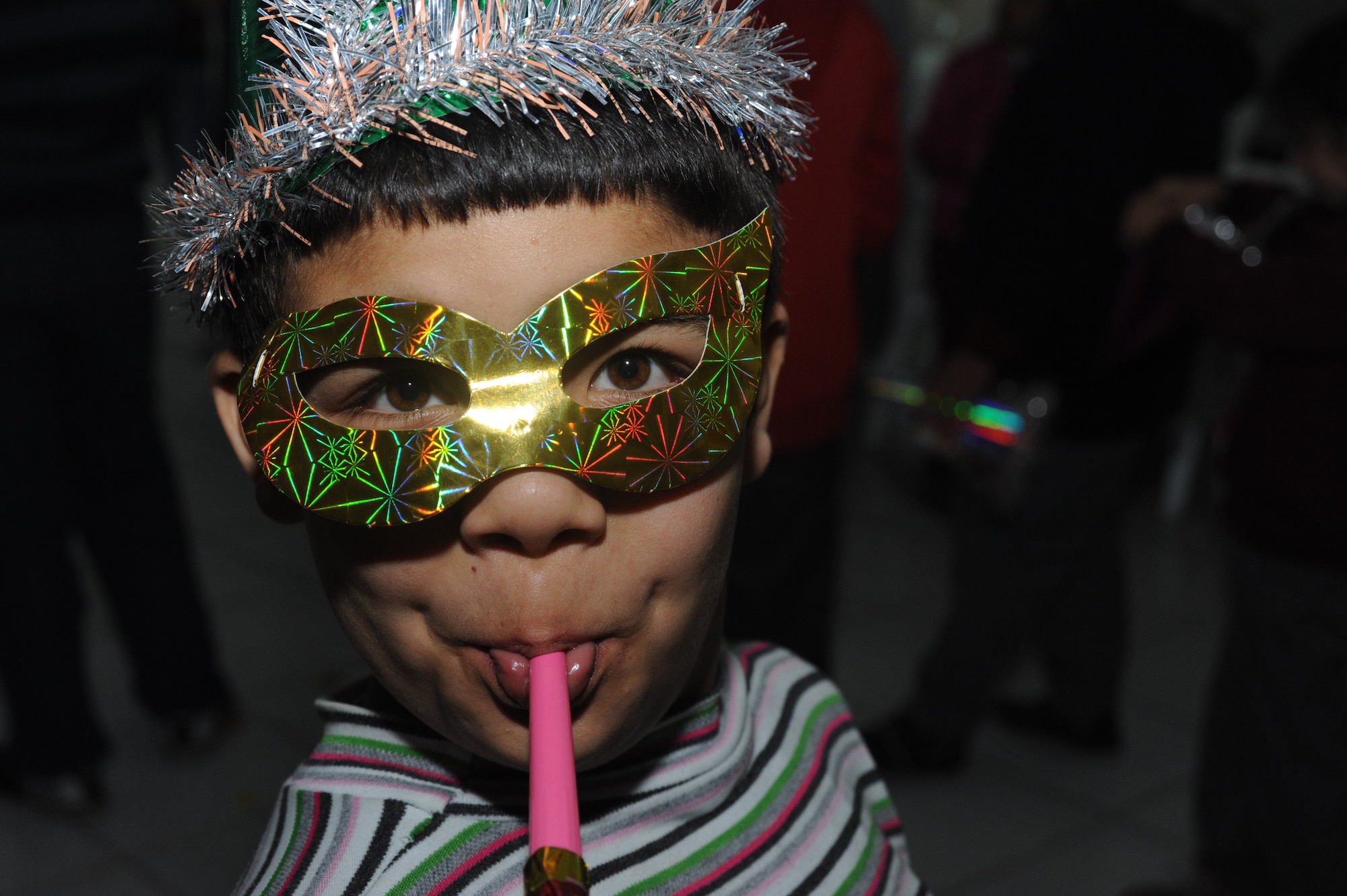 A Turkish youth at the Seyhan Isitme elementary school for the hearing impaired celebrates at a New Year’s party hosted by a group of seven U.S. personnel from Incirlik Air Base at the school Dec. 26, 2013, in Adana, Turkey. Team Incirlik members donated 78 gifts, a variety of decorations, food and games for the event that was facilitated by the Incirlik AB chapel community. (U.S. Air Force photo by 1st Lt. David Liapis/Released)