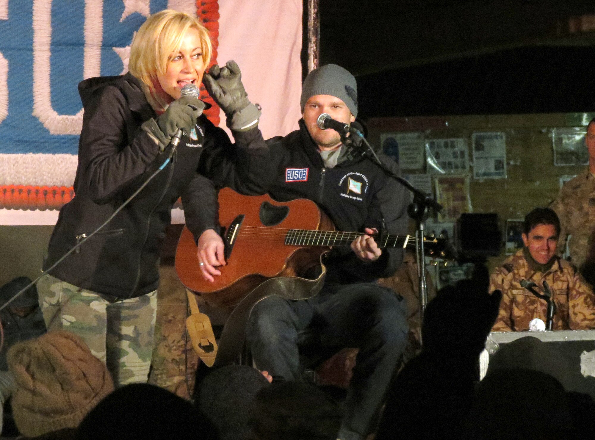Kellie Pickler performs for a Kandahar Airfield audience Dec. 25, 2013, at the Boardwalk on KAF, Afghanistan. Pickler was part of a holiday United Service Organizations Entertainment tour. Since 2007, she has participated in seven USO tours and 75 USO Entertainment events, according to the USO Web site. (U.S. Air Force photo by Senior Airman Alexandria Bandin)
