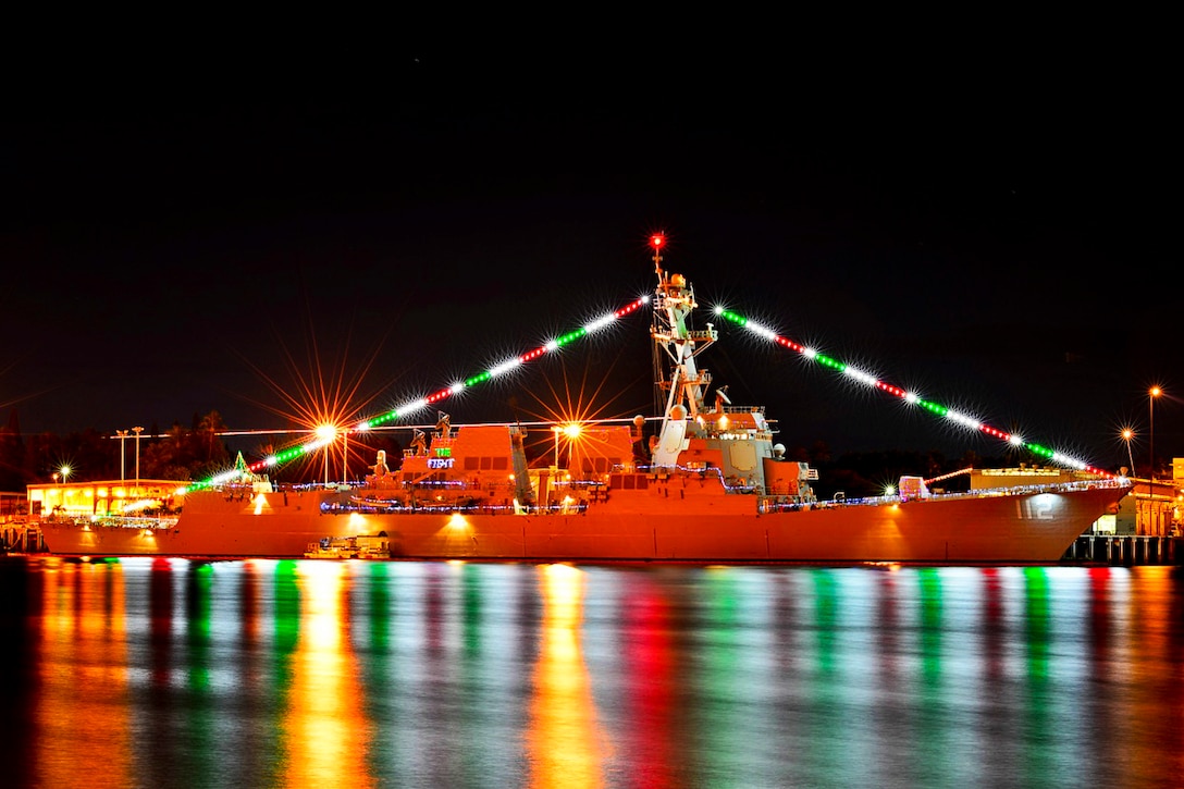 The guided-missile destroyer USS Michael Murphy displays holiday lights pierside during the annual Pearl Harbor Festival of Lights in Pearl Harbor, Dec. 17, 2013. The guided missile destroyer was named after Lt. Michael Murphy, a Navy seal and Medal of Honor recipient, who was killed in action in the Hindu Kush mountains of Afghanistan in June 2005. 