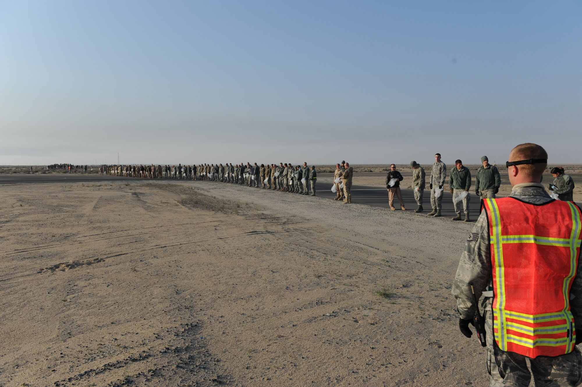386th Expeditionary Maintenance Group host the 386th Air Expeditionary Wing quarterly foreign object debris walk, undisclosed location, Southwest Asia. The purpose of the FOD walk was to reduce the number of foreign objects from the flight line that could potentially damage an aircraft, engine or aircraft system. (U.S. Air Force photo by Senior Airman Desiree W. Moye)