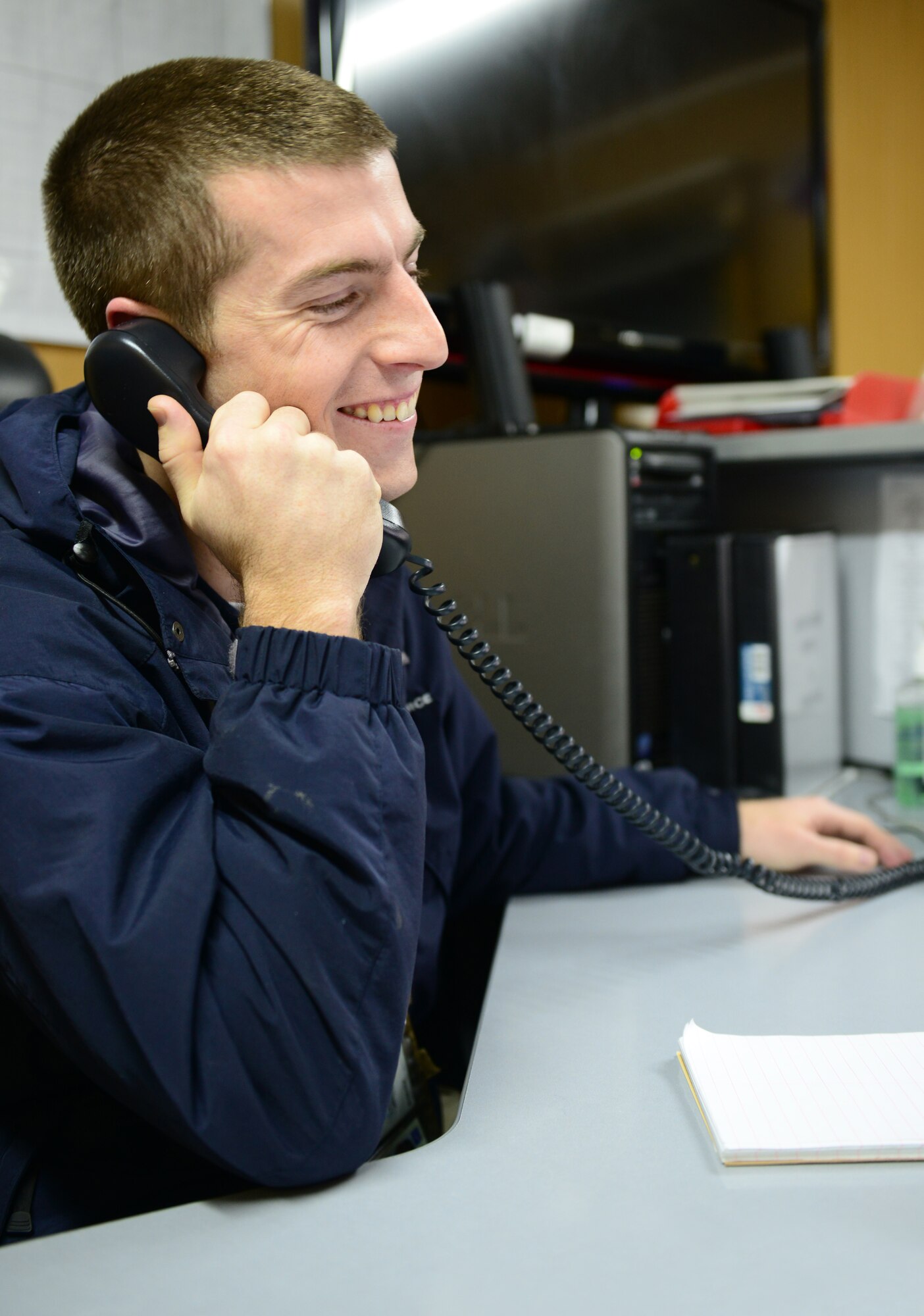 Senior Airman Ryan Hanlon, 376th Expeditionary Operations Support Squadron airfield manager, receives a phone call from Chief Master Sgt. of the Air Force James A. Cody on Christmas Eve, 2013, at the Transit Center at Manas, Kyrgyzstan.  Cody called 15 deployed Airmen on Christmas Eve to wish them a happy holiday season and to thank them for their service. Hanlon is deployed from Hickam Air Force Base, Hawaii, and is a native of Santa Rosa, Calif. (U.S. Air Force photo/Staff Sgt. Travis Edwards)