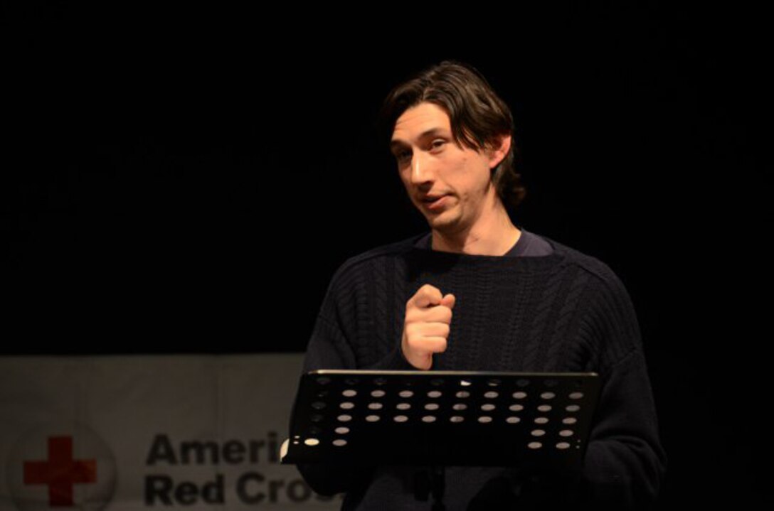Actor and U.S. Marine Corps veteran Adam Driver connects with the audience as he performs a monologue from Sam Shepard's play, "Curse of the Starving Class," during the Arts in the Armed Forces performance at the Grafenwoehr Performing Arts Center in Germany, Dec. 18, 2013.