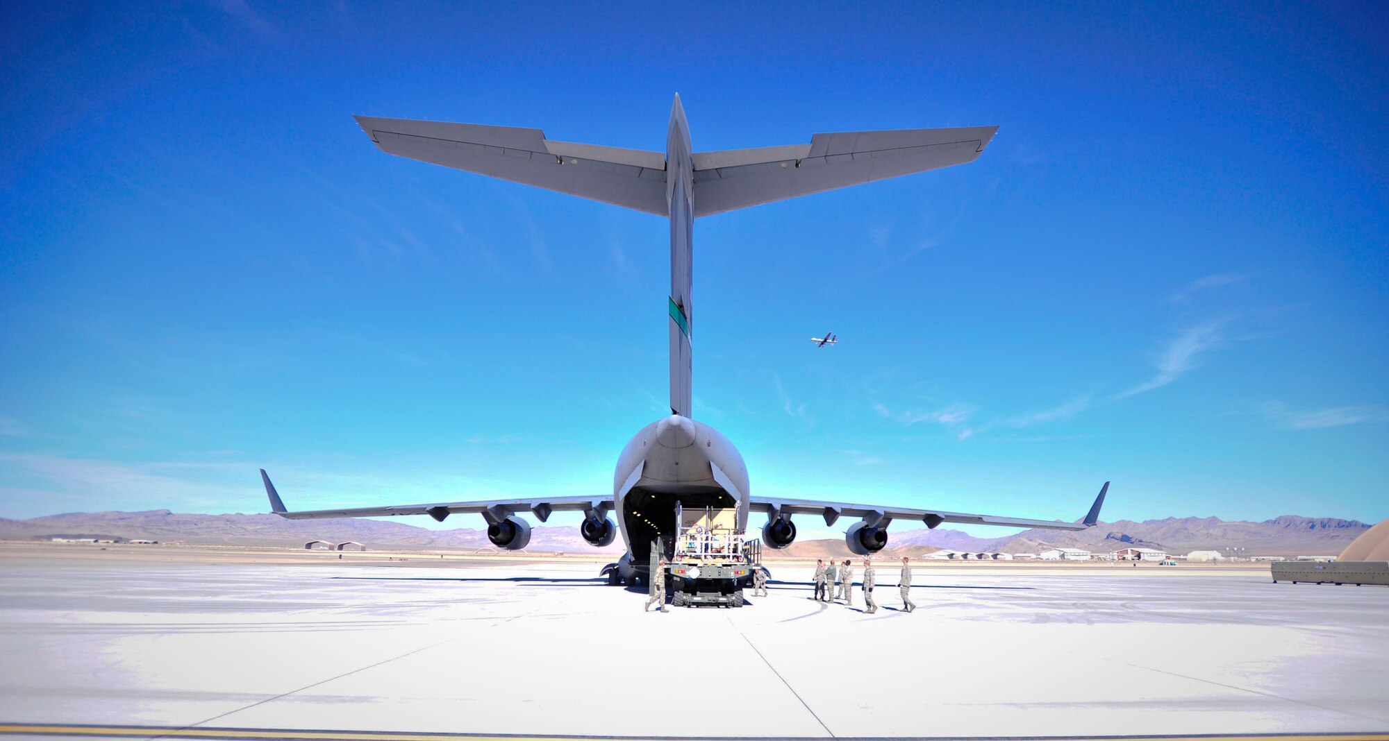 A C-17 Globemaster sits on a flightline prior to the loading of remotely piloted aircraft equipment Dec. 30, 2013. The equipment will travel down range to support U.S. and coalition troops overseas. (U.S. Air Force photo/Staff Sgt. A.D.)