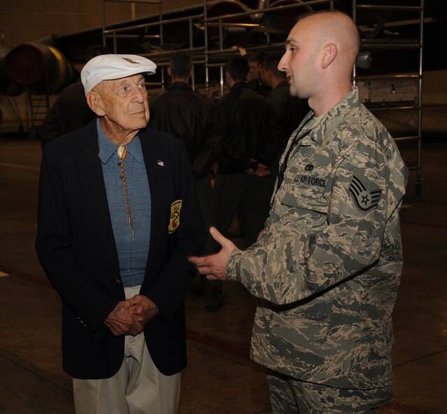 Staff Sgt. Michael Singleton, 2nd Aircraft Maintenance Squadron crew chief, speaks with retired Lt. Col. Richard Cole, Doolittle Raider copilot, on Barksdale Air Force Base, La., Dec. 30, 2013. Cole, one of only four living Doolittle Raiders, met with Airmen during a recent visit to Barksdale. (U.S. Air Force/Staff Sgt. Sean Martin)

