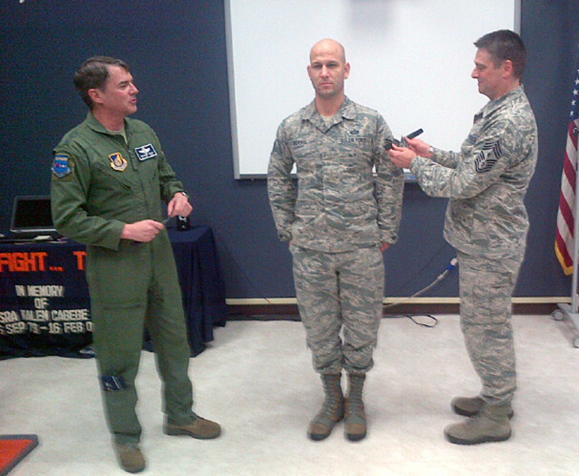 CAMP RED CLOUD, Republic of Korea - Lt. Gen. Jan-Marc Jouas, 7th Air Force commander, and Command Chief Master Sgt. Scott Delveau, 7th AF command chief, promote Staff Sgt. Justin Bernal, 604th Air Support Operations Squadron, to the rank of technical sergeant during a STEP promotion ceremony on Camp Red Cloud, Republic of Korea, Dec. 19, 2013. (Courtesy photo)
