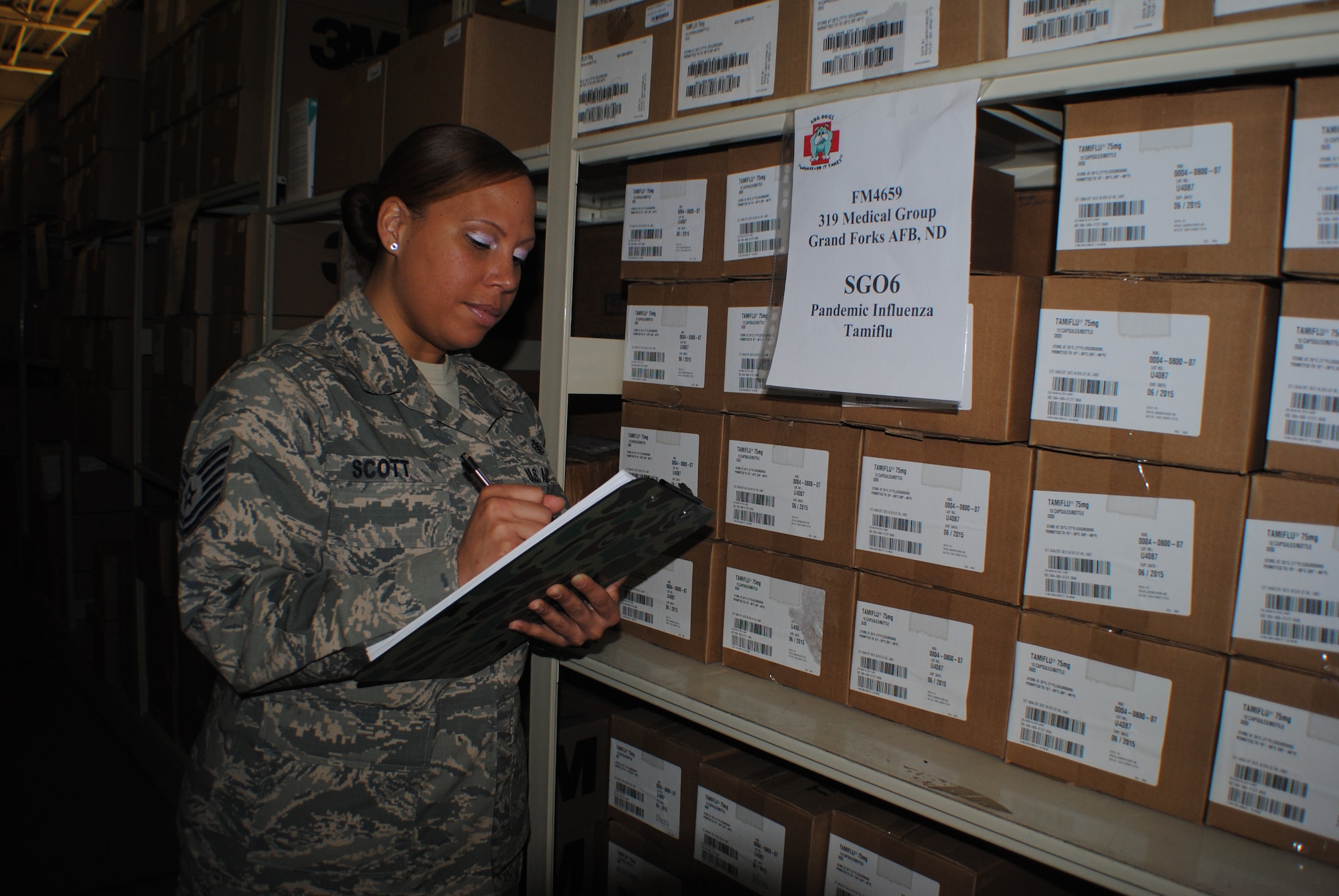 Tech. Sgt. Brandie M. Scott, medical logistics flight chief for the 319th Medical Support Squadron, takes inventory of Tamiflu at the 319th Medical Group’s medical logistics warehouse Dec. 27, 2013, on Grand Forks Air Force Base, N.D. A significant supply of Tamiflu is stored at the warehouse as a precautionary measure in case of a possible influenza outbreak. (U.S. Air Force photo/Staff Sgt. Luis Loza Gutierrez)