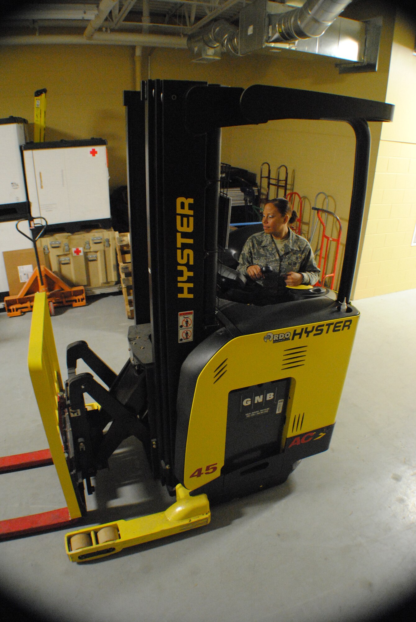 Tech. Sgt. Brandie M. Scott, 319th Medical Support Squadron medical logistics flight chief, maneuvers a forklift into place at the 319th Medical Group’s medical logistics warehouse Dec. 27, 2013, on Grand Forks Air Force Base, N.D. Scott was named the Outstanding Medical Materiel NCO of the Year for the 2013 Air Mobility Command Air Force Medical Service Awards. (U.S. Air Force photo/Staff Sgt. Luis Loza Gutierrez) 
