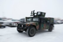 Airmen from the 91st Missile Security Forces Squadron, return from the missile field to Minot Air Force Base, N.D. Dec. 13, 2013. Members of the 91st MSFS operate on 12-hour shifts, and are on alert 24/7, 365 days a year, ready to deploy at a moment's notice to launch and missile alert facilities. (U.S. Air Force photo/Senior Airman Stephanie Sauberan)