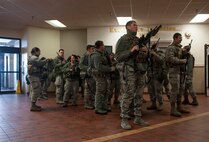 Airman from the 91st Missile Security Forces Squadron Flight 3,  prepare to turn their weapons back in to the armory after returning from the missile field to Minot Air Force Base, N.D. Dec. 13, 2013. Airmen from the 91st MSFS work 12-hour shifts, and work on a nine-day schedule, three days off, two eight-hour training days on base and four consecutive days in the field. (U.S. Air Force photo/Senior Airman Stephanie Sauberan)