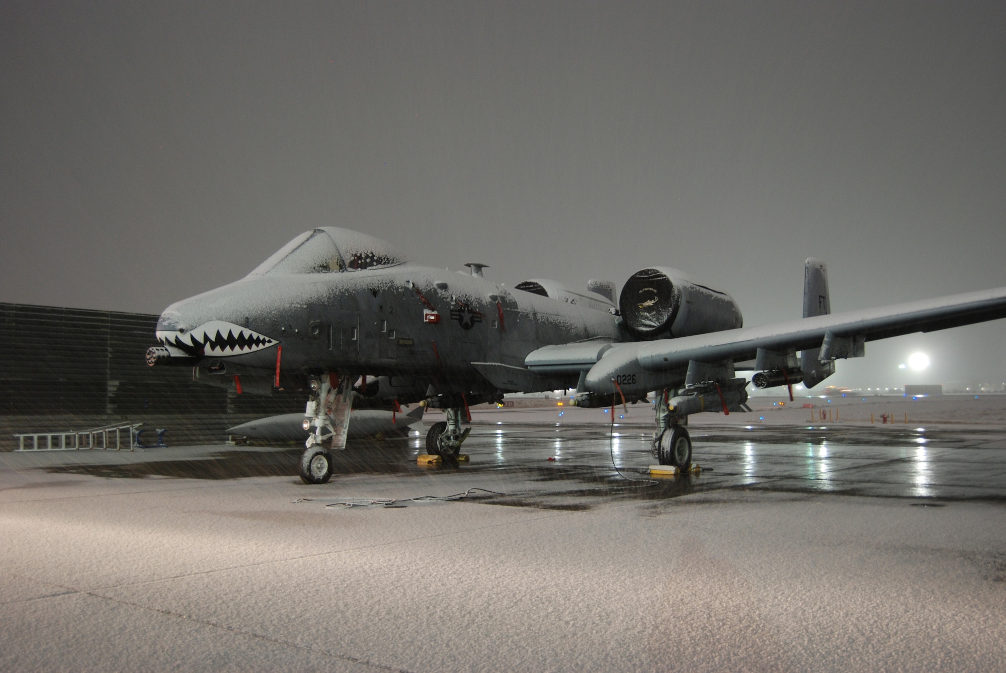 Snow accumulates on an A-10 Thunderbolt II during a snowstorm Dec. 29, 2013 at Bagram Airfield, Afghanistan. This was the first measurable snow of the 2013-2014 Winter. (U.S. Air Force Photo by Capt. Brian Wagner/Released)