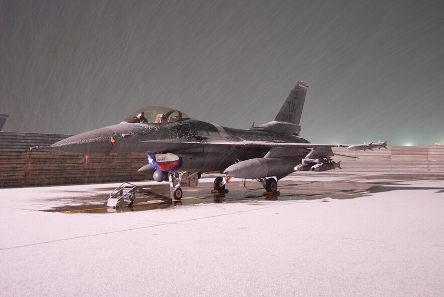 Snow accumulates on an F-16 Fighting Falcon during a snowstorm Dec. 29, 2013 at Bagram Airfield, Afghanistan. This was the first measurable snow of the 2013-2014 Winter. (U.S. Air Force Photo by Capt. Brian Wagner/Released)