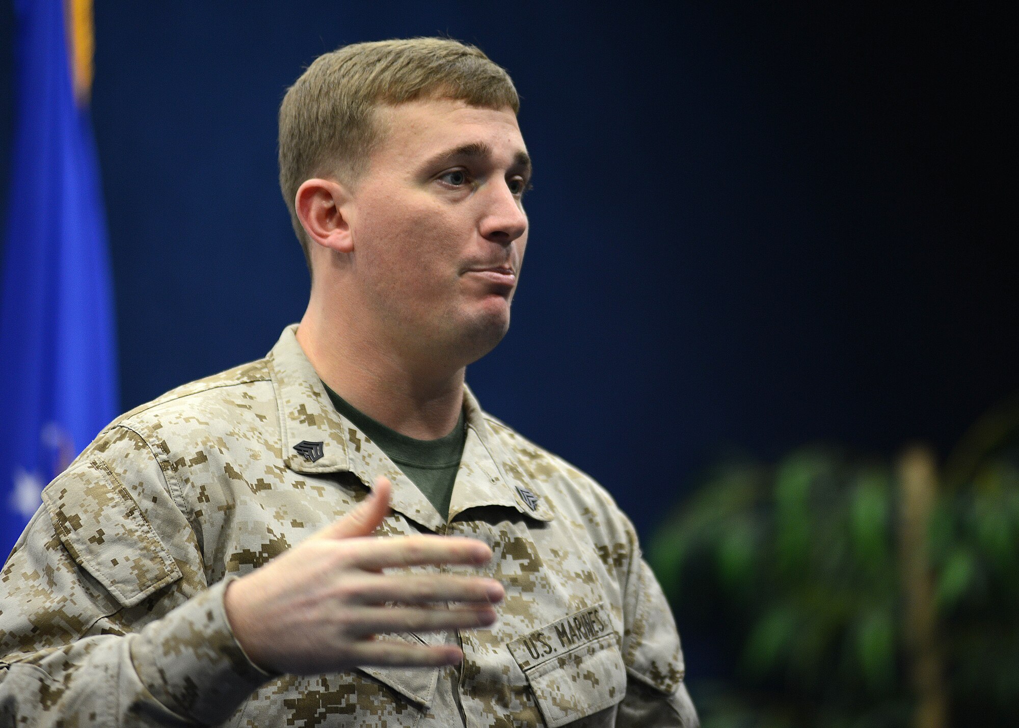 Marine Sgt. Dakota Meyer, U.S. Medal of Honor recipient, speaks to Team Aviano members, Dec. 30, 2013, at Aviano Air Base, Italy. Meyer received the military’s highest honor, Sept. 15, 2011, for personally evacuating 12 friendly wounded and providing cover for another 24 Marines and soldiers to escape likely death at the hands of a numerically superior and determined foe. (U.S. Air Force photo/Staff Sgt. Evelyn Chavez) 