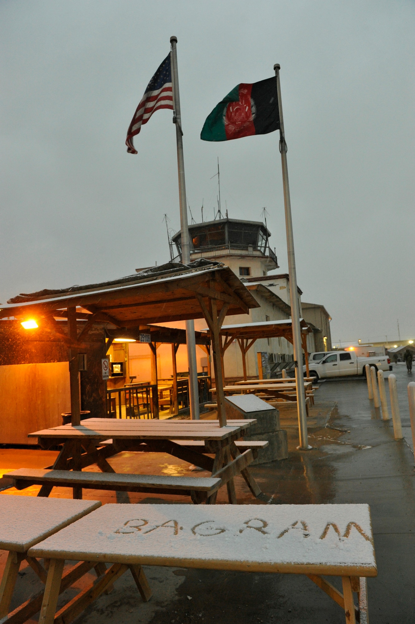 A picnic table sits covered in snow near the Old Russian Tower on Bagram Airfield, Afghanistan, after the first snowfall of the year, December 29, 2013.(U.S. Air Force photo by Senior Master Sgt. Gary J. Rihn/Released)