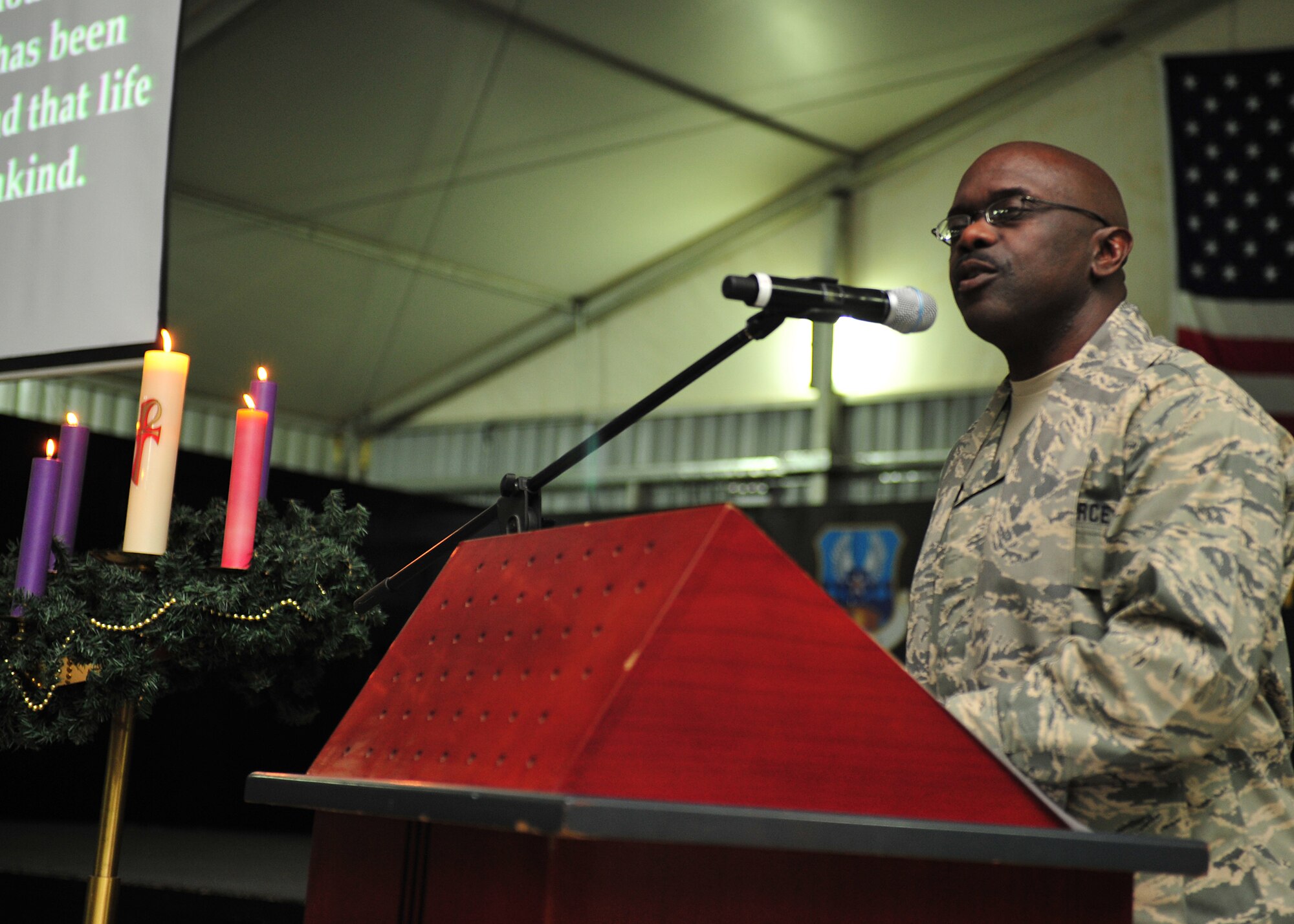 Chaplain (Lt. Col.) Harold Owens, 380th Air Expeditionary Wing, speaks during an ecumenical candlelight worship service at an undisclosed location in Southwest Asia, Dec. 22, 2013. Spiritual resilience is strengthening a set of beliefs, principles or values that sustain an individual's sense of well-being and purpose. (U.S. Air Force photo by Staff Sgt. Michael Means/Released)