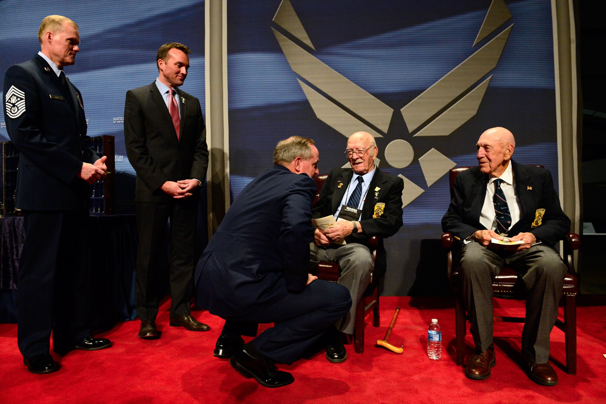 Chief Master Sgt. of the Air Force James A. Cody, left, Acting Secretary of the Air Force Eric Fanning and Chief of Staff of the Air Force Gen. Mark A. Welsh III speak to The Doolittle Raiders (Lt. Col. Edward J. Saylor, Lt. Col. Richard E. Cole) after their final toast at the National Museum of the U.S. Air Force Nov. 09, 2013 in Dayton, Ohio. (U.S. Air Force photo/Desiree N. Palacios)