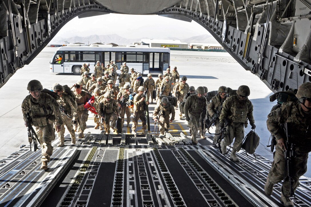 U.S. soldiers walk into a C-17 Globemaster III cargo aircraft in Kabul, Afghanistan, Dec. 28, 2013, as they begin their journey home. The soldiers are assigned to 1st Battalion, 294th Infantry Regiment, Guam Army National Guard.