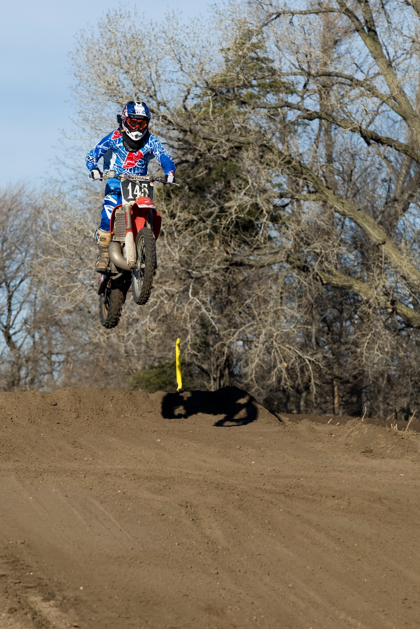 2nd Lt. Michael Reardon jumps on his dirt bike, Dec. 15, 2013, during a race in Maize, Kan. Reardon is the deputy chief of program development with the 22nd Civil Engineer Squadron at McConnell Air Force Base, Kan. Motocross is one of many outdoor activities Reardon engages himself in, including: snowboarding, competitive pistol shooting and team sports. 