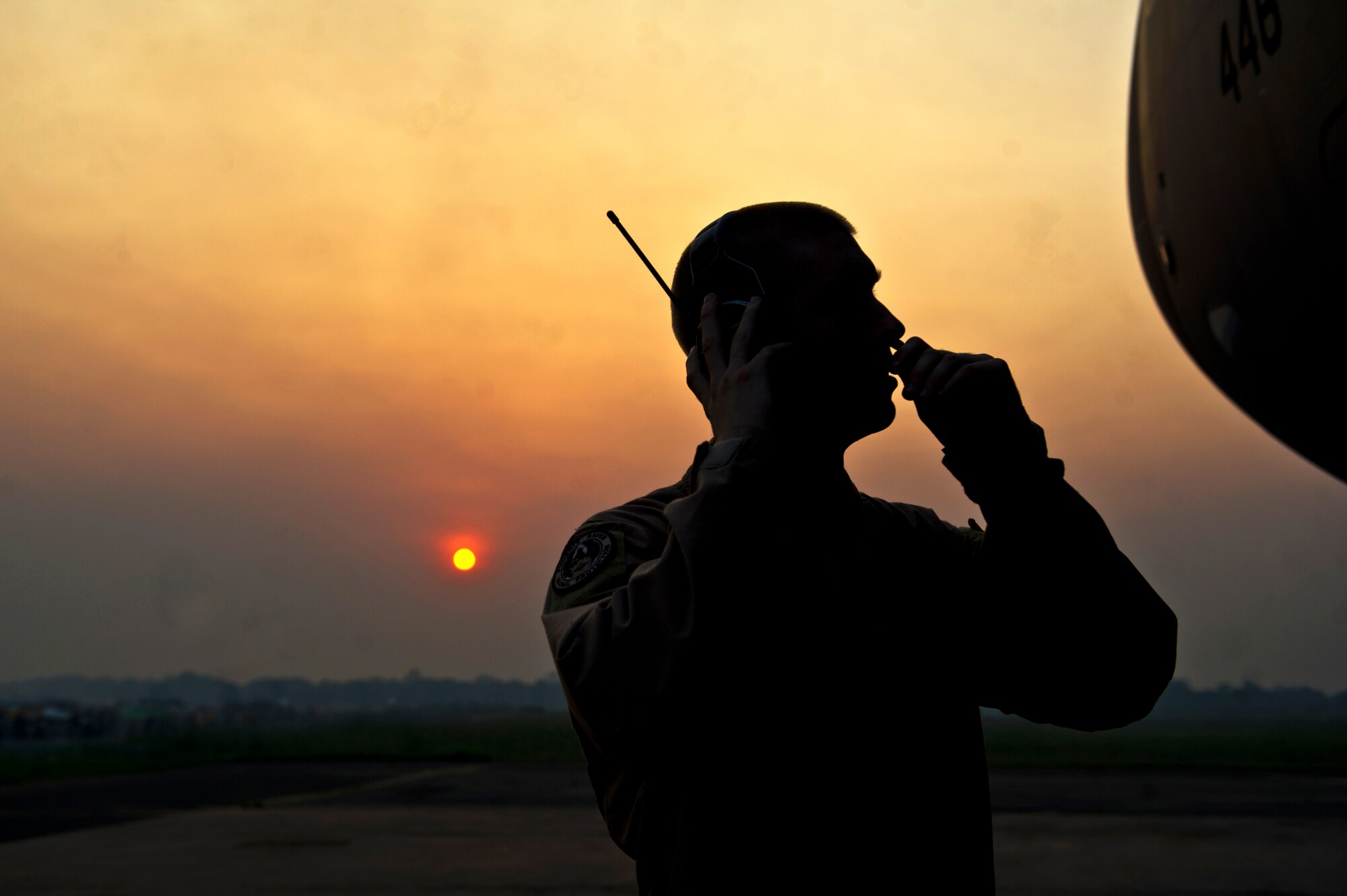 Staff Sgt. Billy Hepworth, a Phoenix Raven, communicates with his team Dec. 17, 2013 at Bangui Airport, Central African Republic (CAR). In coordination with the French military and African Union, the U.S. military provided airlift support to transport Burundi soldiers, food and supplies in the CAR. This support is aimed at enabling African forces to deploy promptly to prevent further spread of sectarian violence and restore security in CAR. (U.S. Air Force photo by Staff Sgt. Erik Cardenas)